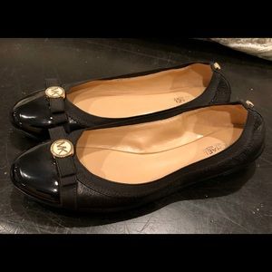 Black patent flats. MK
